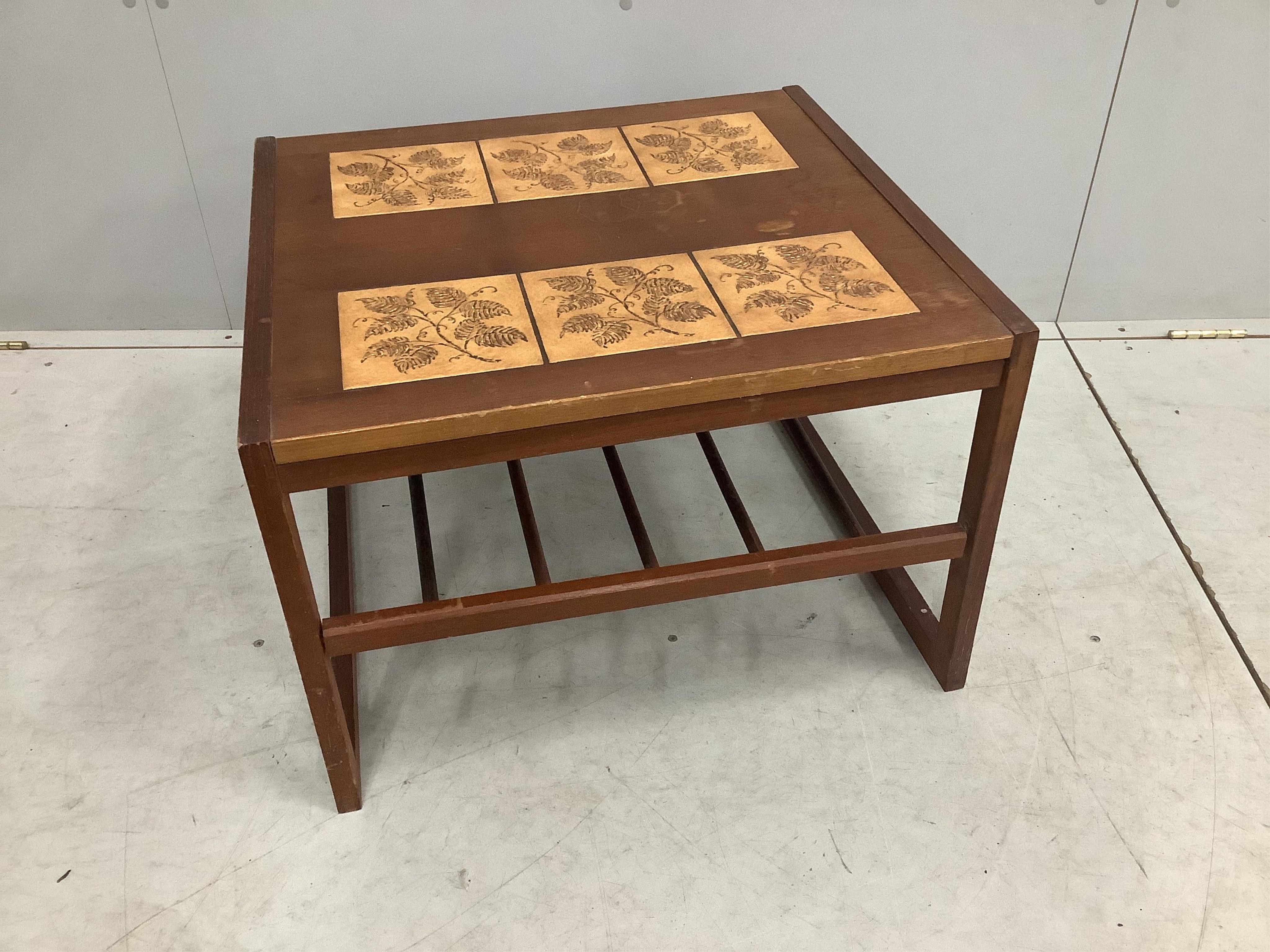 A mid century teak two tier tile top coffee table, width 60cm, depth 54cm, height 42cm. Condition - poor to fair